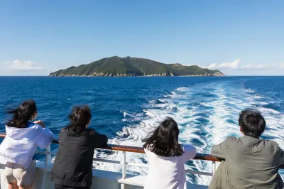 Ferry Crossing Blue Water Toward Island