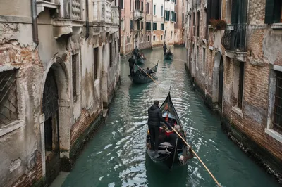 Venetian Gondolas Along Historic Narrow Canal