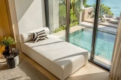 Luxury Hotel Daybed Beside Turquoise Pool