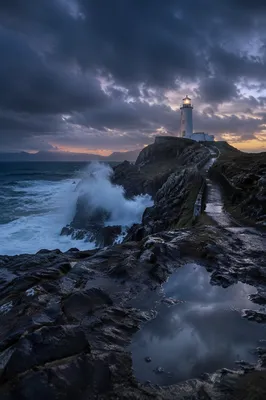 Solitary Lighthouse Above Dramatic Ocean Coast