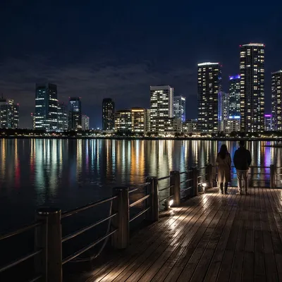 Serene Night Waterfront City Skyline Reflections