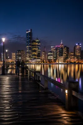 Serene Night Waterfront City Skyline Reflections