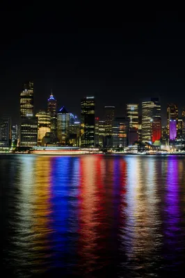 Modern Night Skyline Across Harbor Waters