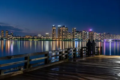 Serene Night Waterfront City Skyline Reflections