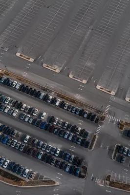 Aerial Parking Lot Rows Near Transit