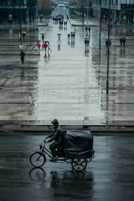 Rainy City Street Reflections with Umbrella