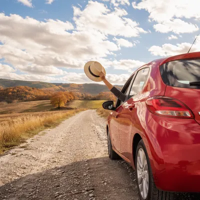 Red Car Road Trip in Autumn Countryside