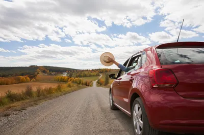 Red Car Road Trip in Autumn Countryside