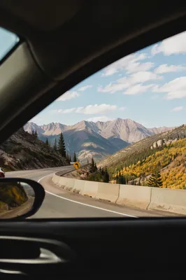 Open Mountain Highway Through Car Window