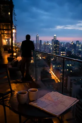 Blue Hour Rooftop Cityscape With Evening Lights