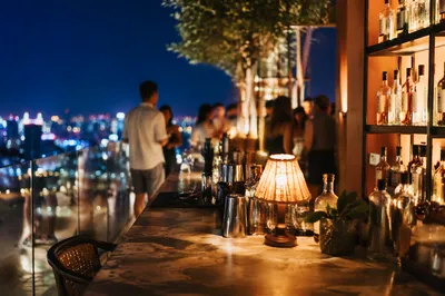 Evening Rooftop Bar Over City Lights