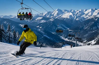 Snowboarder on Sunny Alpine Ski Slope