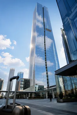 Glass Skyscraper Reflecting Morning Clouds