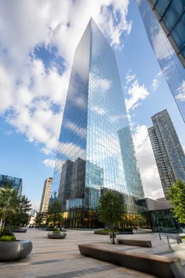 Glass Skyscraper Reflecting Morning Clouds
