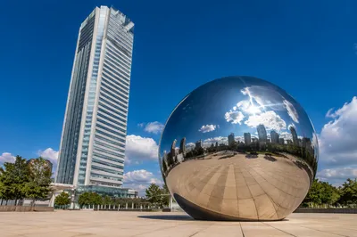 Modern Skyscraper and Mirrored Sphere Plaza