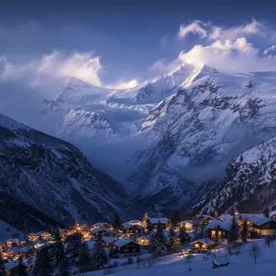 Cozy Alpine Village Beneath Snowy Peaks