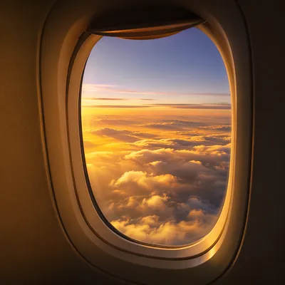 Golden Sunset Clouds From Airplane Window