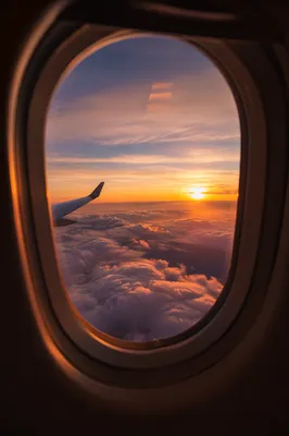 Golden Sunset Through Airplane Window