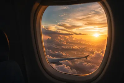 Golden Sunset Clouds From Airplane Window