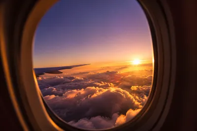 Golden Sunset Through Airplane Window