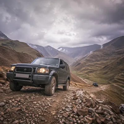 Rugged SUV on Misty Mountain Trail