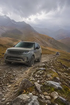 Rugged SUV on Misty Mountain Trail
