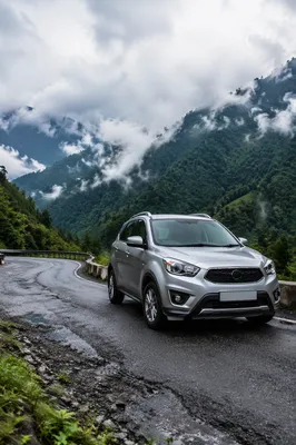 Silver SUV on Misty Mountain Road