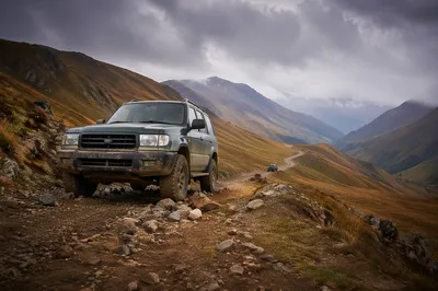 Rugged SUV on Misty Mountain Trail