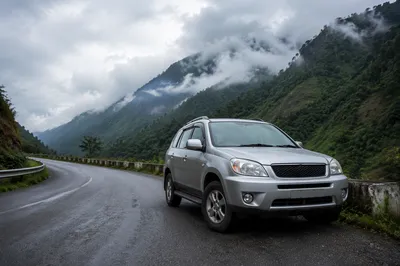 Silver SUV on Misty Mountain Road