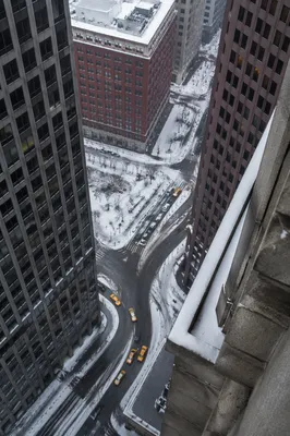 Yellow Taxis on Snowy Downtown Street