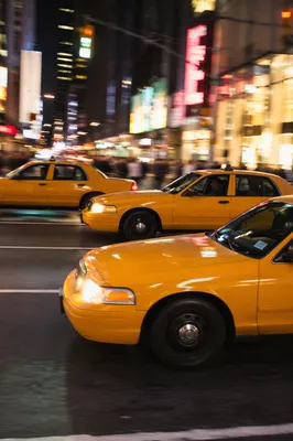 Yellow Taxi Cabs on Downtown Night Street