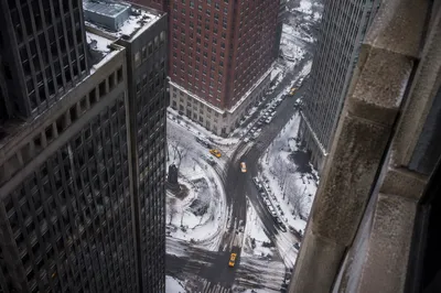 Snowy Downtown Street with Yellow Taxis