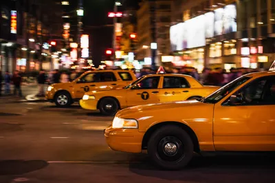 Yellow Taxi Cabs on Downtown Night Street