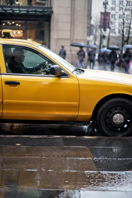 Yellow Taxi on Rainy City Street