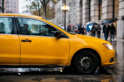 Yellow Taxi on Rainy City Street