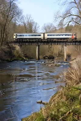 Regional Train Crossing Rural River Bridge