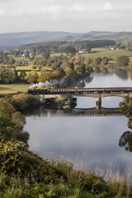 Vintage Train Crossing Quiet Countryside River