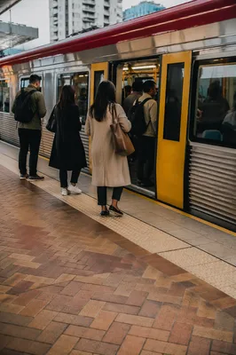 City Commuters Boarding Yellow Train Platform
