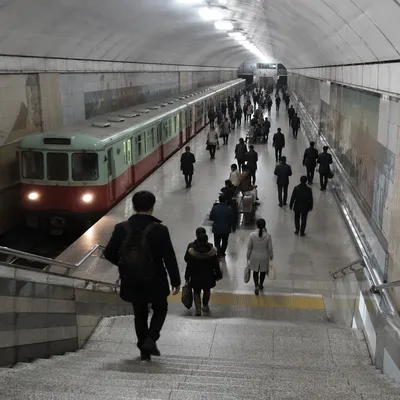 Busy Underground Train Platform with Commuters
