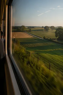 Peaceful Countryside View Through Train Window
