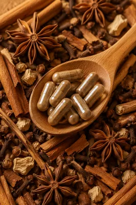 Natural Herbal Capsules in Rustic Wooden Spoon