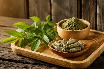 Natural Herbal Capsules on Wooden Spoon