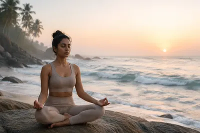 Woman Meditating by Ocean at Dawn