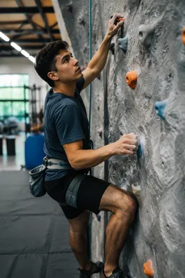 Man Climbing Indoor Rock Wall