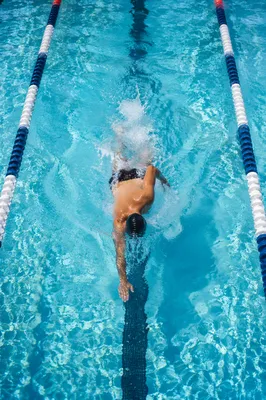 Overhead Swimmer Training in Turquoise Lap Pool