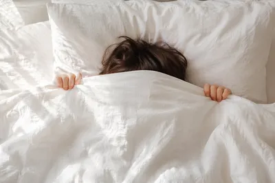 Peaceful Morning Rest in White Bedding