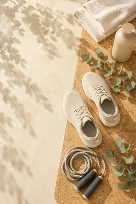 Sport Shoes and Jump Rope Flat Lay