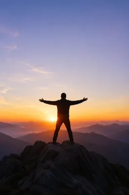 Triumphant Sunrise Silhouette on Mountain Peak