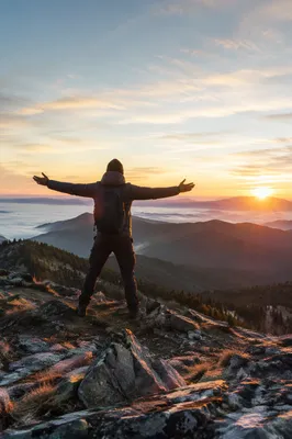 Sunrise Victory Stretch on Mountain Peak