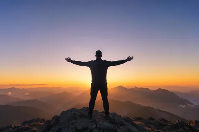Sunrise Mountain Victory with Open Arms